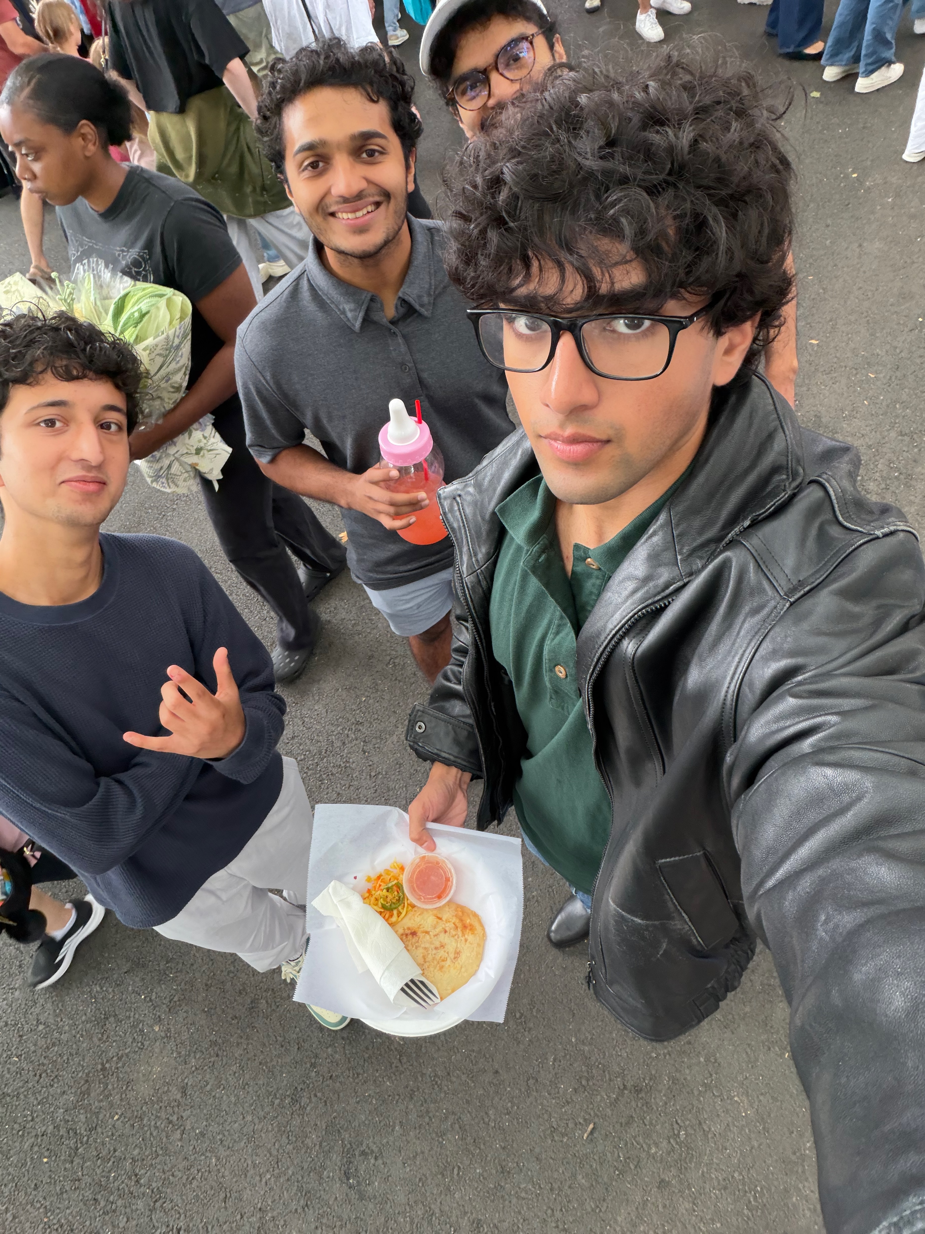 Yash with friends at a food market.